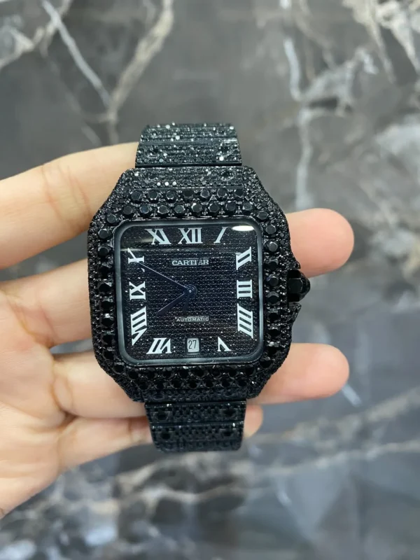 Discover the Full Iced Out Black Moissanite Cartier Santos Watch with All Black PVD coating. A bold luxury timepiece featuring moissanite brilliance, iced-out design, and sleek black finish for a modern, sophisticated look.