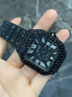 Discover the Full Iced Out Black Moissanite Cartier Santos Watch with All Black PVD coating. A bold luxury timepiece featuring moissanite brilliance, iced-out design, and sleek black finish for a modern, sophisticated look.
