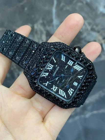 Discover the Full Iced Out Black Moissanite Cartier Santos Watch with All Black PVD coating. A bold luxury timepiece featuring moissanite brilliance, iced-out design, and sleek black finish for a modern, sophisticated look.
